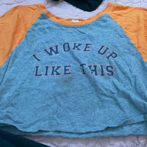 A crop top that says I woke up like this